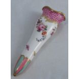 A 19th century English porcelain posy holder, decorated with a scale pink border, with flowers below