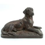 Doris Lindner, a bronze effect model of a dog lying down, height 6ins, width 8insCondition Report: