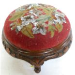 A 19th century mahogany framed foot stool, with bead work and tapestry top, and carving to the