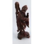 An Oriental root carving, formed as a figure, height 12ins