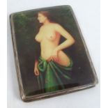 A silver cigarette case, the cover with a later applied resin image of a bare breasted woman in a