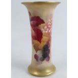 A Royal Worcester trumpet shaped vase, decorated with Autumnal fruits and leaves by Kitty Blake,