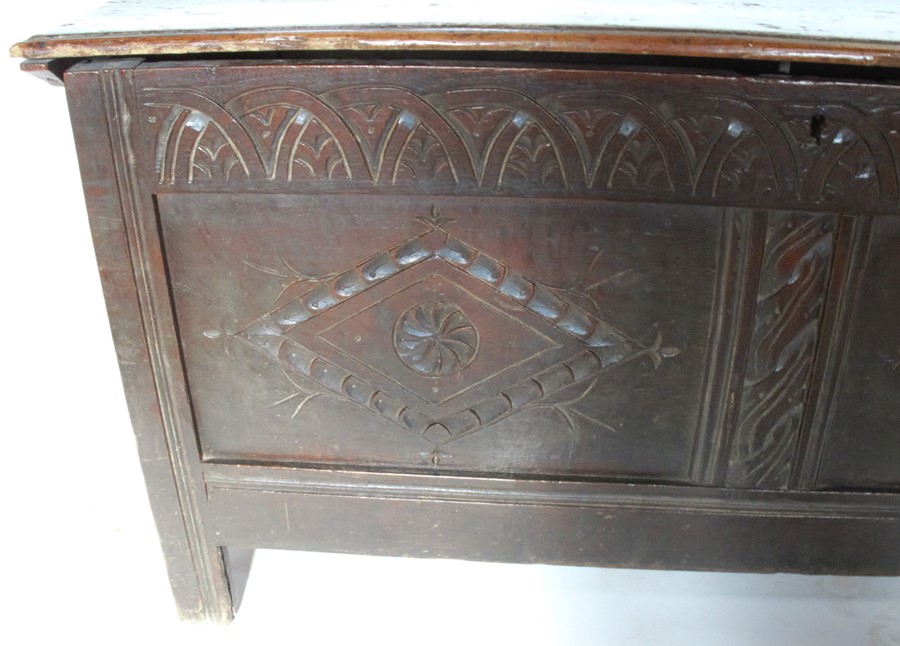 An Antique oak coffer, with twin carved panels to the front, depth 21ins, width 48ins, height 25ins - Image 2 of 3