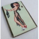 A silver cigarette case, later applied resin image of a glamour girl in diaphanous attire,