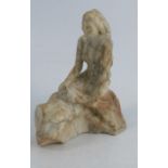An Antique carved marble figure, of a mermaid on a rock, height 5ins