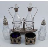 A 19th century silver plated cruet stand, comprising two glass and silver plated mounted bottles,