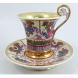A 19th century Paris cabinet cup and saucer, decroated in the Empire taste with a biscuit eagle head
