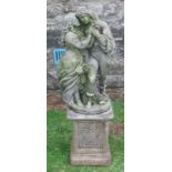 A garden statue, of two figures on a plinth base, height 44ins