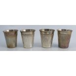 A set of four silver beakers, with reeded decoration, marked 925, maker Mappin & Webb, weight