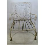 An early 20th century cast and wrought iron garden armchair