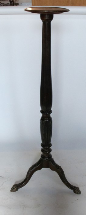 A mahogany torchere stand, with fluted and carved decoration, height 56.5ins