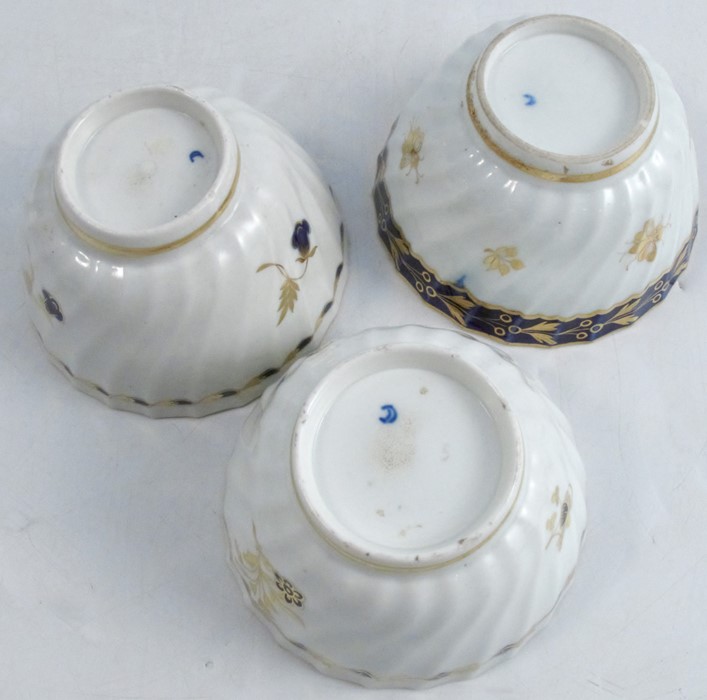 Three 18th century Worcester tea bowls and saucers, the wrythern moulded bodies decorated in blue - Image 9 of 9