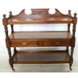 A 19th century mahogany buffet, with break swan pediment to the back, the undershelf having two