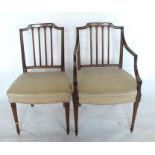 A matched set of fifteen mahogany dining chairs, with reeded supports to the back, over stuff over
