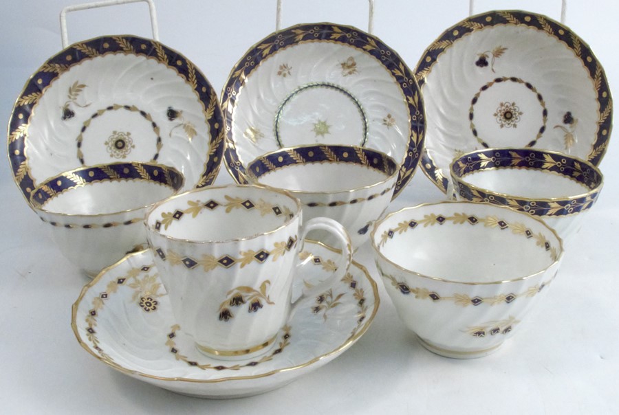 Three 18th century Worcester tea bowls and saucers, the wrythern moulded bodies decorated in blue