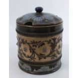 A Doulton Lambeth covered jar, decorated with flowers, numbered to base, dated 1885, height 6.