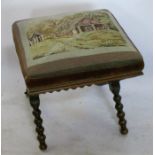 A 19th century mahogany and upholstered foot stool, the tapestry top raised on a bobbin cross
