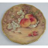 A Royal Worcester cabinet plate, decorated with fruit to a mossy background by P Love, with gilded