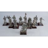 Thirteen various metal models, of British Regimental soldiers, raised on wooden bases, height 4.