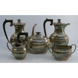 A silver five piece tea service, comprising hot water jug, coffee pot, tea pot, sugar bowl and