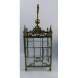 A brass and glass hanging shade, of rectangular form, each side made up of nine leaded bevelled