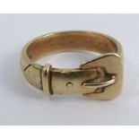 A 9 carat gold buckle ring, finger size S, 5.7g gross