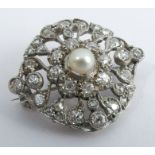 An Edwardian diamond and pearl brooch, unmarked, the 5.5mm pearl (untested and unwarranted),