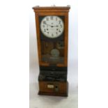 An International Time Recording Co Ltd London clocking in clock, in an oak case, height