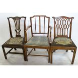 Three 19th century country dining chairs, to include an open armchair, all with tapestry drop in