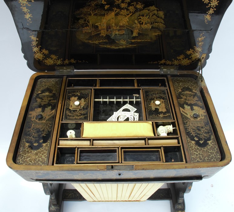 A 19th century papier mache sewing table, decorated in black and gold with Chinoiserie scenes, of - Image 2 of 3