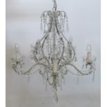 A glass and metal chandelier, with scrolling branches, swags and droppers, height 34ins, together