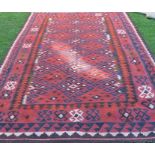 A Kelim rug, decorated with repeating stepped diamonds to the field, 74ins x 120ins