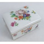 A 19th century Meissen trinket box, the rectangular box with tightly fitting cover painted with
