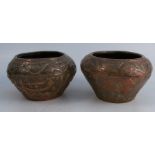 A pair of Eastern copper pots, with embossed decoration, height 4.25ins