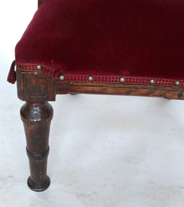 A Victorian oak and upholstered Gothic style chair, with curved back rail and Gothic style supports - Image 3 of 3