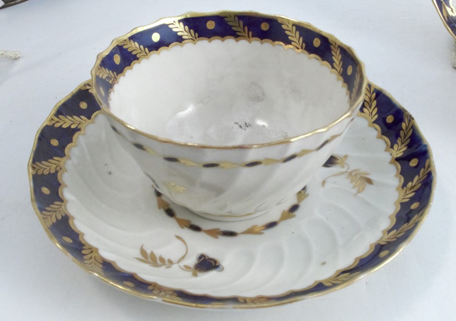 Three 18th century Worcester tea bowls and saucers, the wrythern moulded bodies decorated in blue - Image 2 of 9