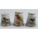 Three Royal Worcester thimbles, all painted with British birds, two signed by PowellCondition