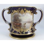 A Royal Worcester two handled loving mug, the one side decorated with a reserve of English cattle