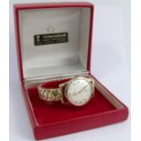 Omega, a gentleman's 9 carat gold mechanical wrist watch, the white circular dial with gilt Arabic