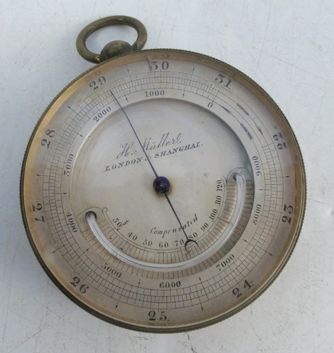 A 19th century gilt metal cased pocket barometer, the silvered dial inscribed H Muller London and