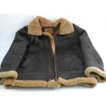An Aviator Italy Bomber jacket, in brown leather and brown sheepskin, size M, together with an