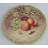 A Royal Worcester cabinet plate, decorated with fruit to a mossy background by H Aryton, with gilded