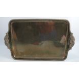A silver tray, of rectangular form, with gadrooned edge, the integral handles embossed with a
