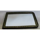A 19th century pier glass mirror, the black frame with gilt decoration, overall dimensions 58ins x