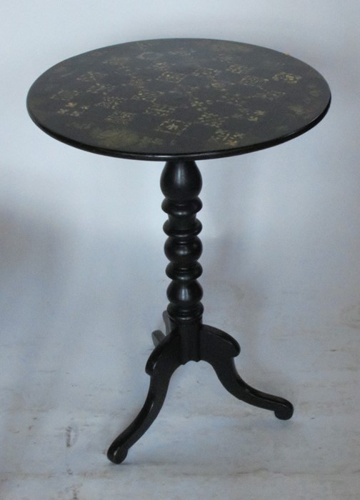 A 19th century occasional table, the circular papier mache top decorated with inlaid mother of pearl