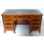A 19th century mahogany and satinwood desk, with leather inset writing surface, having an