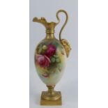 A Royal Worcester ewer, decorated with roses by F Harper, with gilt mask below the handle and raised