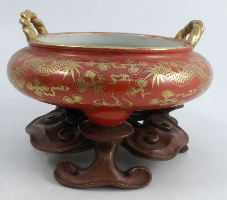 A Chinese porcelain censer, the amber body with gilt five toe dragon decoration and rope handles,