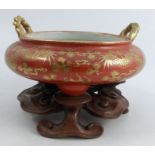 A Chinese porcelain censer, the amber body with gilt five toe dragon decoration and rope handles,