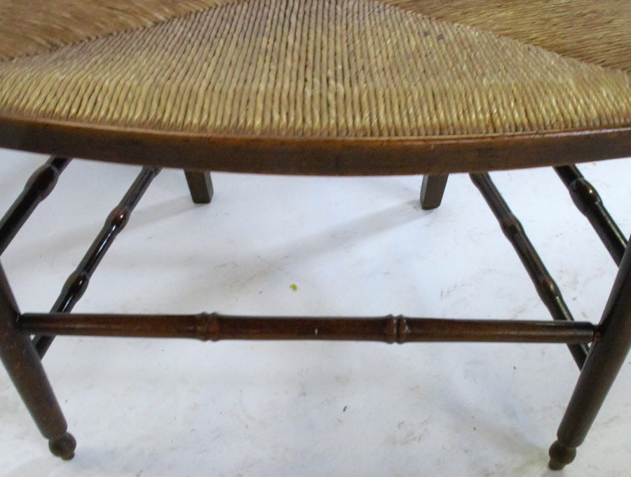 An Antique beech open arm chair, with shield shape back, having a rush seat with turned - Image 5 of 6